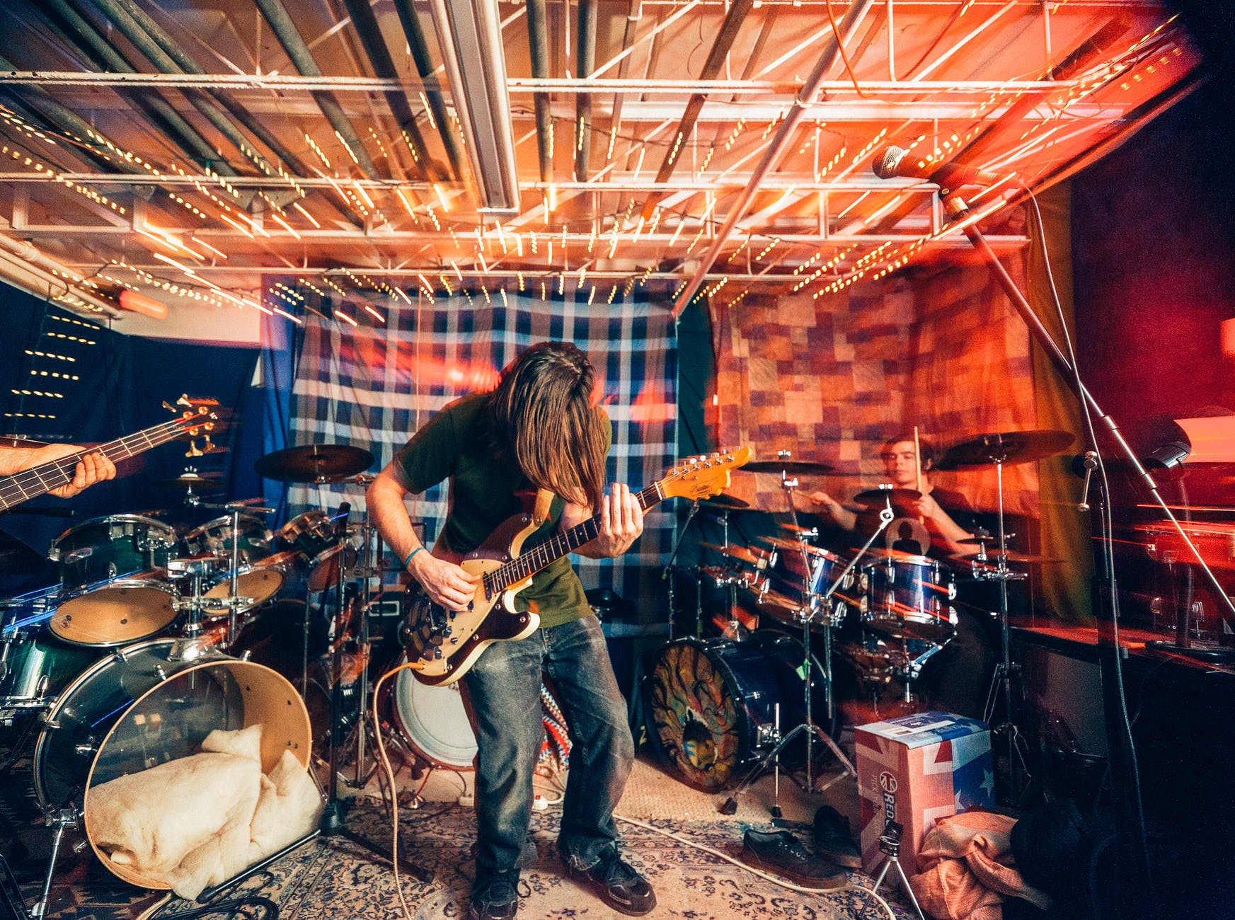 photo of man playing guitar